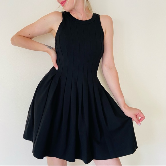 White House Black Market Dresses & Skirts - WHBM pleated sleeveless black mini fit & flare front pockets dress